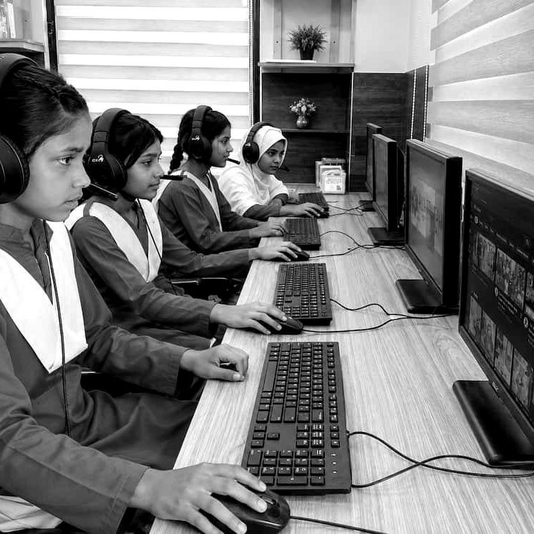 A student at a computer in a smart classroom